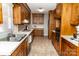 Traditional kitchen with wood cabinets, white countertops and stainless steel sink at 2650 31St Street Ne Ct, Hickory, NC 28601