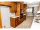 Traditional kitchen with wood cabinets, tile floors and white countertops at 2650 31St Street Ne Ct, Hickory, NC 28601