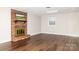 Spacious living room featuring a brick fireplace and laminate wood floors at 2650 31St Street Ne Ct, Hickory, NC 28601