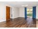 Spacious living room with a sliding glass door and laminate wood floors at 2650 31St Street Ne Ct, Hickory, NC 28601