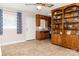 Open living space with custom wooden built-ins and adjacent kitchen at 2650 31St Street Ne Ct, Hickory, NC 28601