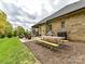 Patio with outdoor seating, stainless grill, and colorful picnic table at 3012 Ocean Dr, Monroe, NC 28110