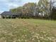 Large backyard with mature trees and a serene, natural setting at 3012 Ocean Dr, Monroe, NC 28110