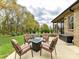 Enjoy outdoor living on the backyard patio, complete with a fire pit and comfortable seating area at 3012 Ocean Dr, Monroe, NC 28110