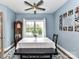 Charming dining area featuring a classic grandfather clock and a gallery wall, perfect for Gathering gatherings and creating memories at 3012 Ocean Dr, Monroe, NC 28110