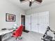 Functional home office featuring a red office chair and a large window that offers ample natural light and views at 3012 Ocean Dr, Monroe, NC 28110