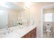 Bathroom featuring a double sink vanity with updated fixtures and a view into the water closet at 3071 Ancestry Cir, Matthews, NC 28104