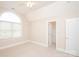Neutral bedroom featuring a large window, closet, and ensuite access at 3071 Ancestry Cir, Matthews, NC 28104