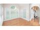 Bright dining area with large windows, hardwood floors, and chandelier at 3071 Ancestry Cir, Matthews, NC 28104