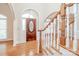 Inviting foyer with hardwood floors and staircase, creating a warm and welcoming atmosphere at 3071 Ancestry Cir, Matthews, NC 28104