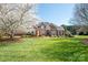 Charming two-story brick home with manicured lawn and mature landscaping, perfect for suburban living at 3071 Ancestry Cir, Matthews, NC 28104