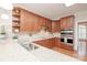Well-lit kitchen with wood cabinets, stainless steel appliances, and speckled countertops at 3071 Ancestry Cir, Matthews, NC 28104