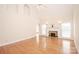 Spacious, light-filled living room with a fireplace and beautiful hardwood floors at 3071 Ancestry Cir, Matthews, NC 28104