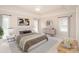 Cozy staged bedroom with a decorative rug and tray ceiling at 3071 Ancestry Cir, Matthews, NC 28104