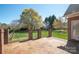 Charming stone patio with brick and iron fencing overlooking a well-manicured lawn at 3071 Ancestry Cir, Matthews, NC 28104