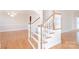 Elegant staircase with hardwood floors and natural light, adding architectural interest to the home at 3071 Ancestry Cir, Matthews, NC 28104