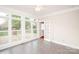 Bright sunroom with large windows and sliding glass doors to the backyard at 3071 Ancestry Cir, Matthews, NC 28104