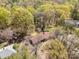 Aerial view of a home nestled amongst mature trees, offering privacy and natural beauty at 340 Sardis N Rd, Charlotte, NC 28270