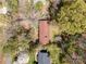 Aerial view of the house in a wooded neighborhood at 340 Sardis N Rd, Charlotte, NC 28270