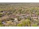 Wide aerial shot displaying a neighborhood surrounded by lush trees and various architectural styles at 340 Sardis N Rd, Charlotte, NC 28270