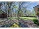 Spacious backyard area with mature trees and shed at 340 Sardis N Rd, Charlotte, NC 28270
