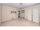 This bedroom offers closet space, carpet and an entry to another room at 340 Sardis N Rd, Charlotte, NC 28270