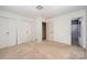 A bedroom provides closet space and entry to an ensuite bathroom at 340 Sardis N Rd, Charlotte, NC 28270