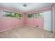 A pink bedroom includes two windows, carpet and a simple color scheme at 340 Sardis N Rd, Charlotte, NC 28270
