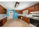 This kitchen offers wooden cabinets, a window and white appliances at 340 Sardis N Rd, Charlotte, NC 28270