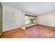 Bright living room with hardwood floors, a large window, and a classic design, offering a spacious and welcoming atmosphere at 340 Sardis N Rd, Charlotte, NC 28270