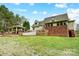 Large backyard features a deck, patio, and covered outdoor kitchen, perfect for entertaining and relaxation at 361 Nance Rd, Stanfield, NC 28163