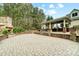Backyard patio with stone fireplace, stone columns and paved flooring at 361 Nance Rd, Stanfield, NC 28163