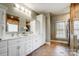 Bathroom with double vanity, modern fixtures, and neutral tiling at 361 Nance Rd, Stanfield, NC 28163