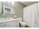 Stylish bathroom featuring modern fixtures, a marble vanity and shower curtain at 361 Nance Rd, Stanfield, NC 28163