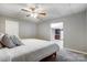 Comfortable bedroom with ceiling fan and a glimpse of the kitchen at 361 Nance Rd, Stanfield, NC 28163