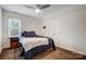 Cozy bedroom with a ceiling fan, window and carpet, perfect for relaxing and resting at 361 Nance Rd, Stanfield, NC 28163