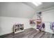 Attic converted to bright playroom with gray vinyl floors and ample storage at 361 Nance Rd, Stanfield, NC 28163