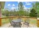 Deck featuring a view of the backyard, wooden railings and metal furniture at 361 Nance Rd, Stanfield, NC 28163
