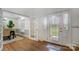 Bright foyer with hardwood floors, decorative front door, and views into the dining room at 361 Nance Rd, Stanfield, NC 28163