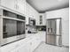 Spacious kitchen with stainless steel appliances, white cabinets, and ample counter space at 361 Nance Rd, Stanfield, NC 28163