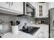 Modern kitchen featuring gray subway tile backsplash, sleek appliances, and white cabinets at 361 Nance Rd, Stanfield, NC 28163