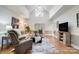Spacious living room with vaulted ceilings, hardwood floors, and a large window for natural light at 361 Nance Rd, Stanfield, NC 28163