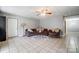 Inviting living room featuring a plush sectional sofa and tiled floor at 361 Nance Rd, Stanfield, NC 28163