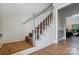 Elegant staircase with white banisters and carpeted steps leading to the next level at 361 Nance Rd, Stanfield, NC 28163
