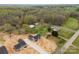 Spacious aerial view of new homes, outbuildings, and land, offering a country living feel at 3957 Miller Rd, Salisbury, NC 28147