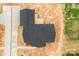 Overhead view of a new house with dark roof and modern outdoor deck construction with surrounding landscape at 3957 Miller Rd, Salisbury, NC 28147