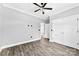 Bedroom features wood flooring, ceiling fan, and a closet at 3957 Miller Rd, Salisbury, NC 28147