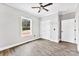 Bedroom features wood floor, a ceiling fan, closet, and natural light from the window at 3957 Miller Rd, Salisbury, NC 28147