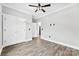 Bedroom features wood flooring, ceiling fan, and a closet at 3957 Miller Rd, Salisbury, NC 28147