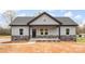 Charming single-story home with stone accents, dark front door, and welcoming front porch at 3957 Miller Rd, Salisbury, NC 28147